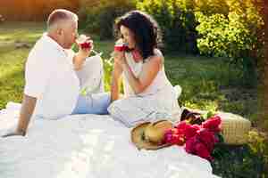 Free photo beautiful adult couple spend time in a summer field