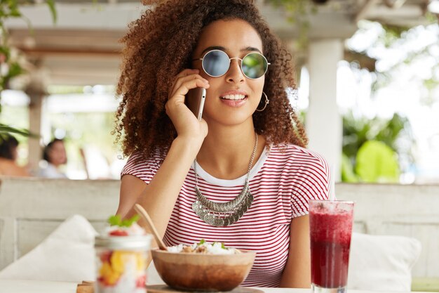 Beautiful African-American woman in cafe