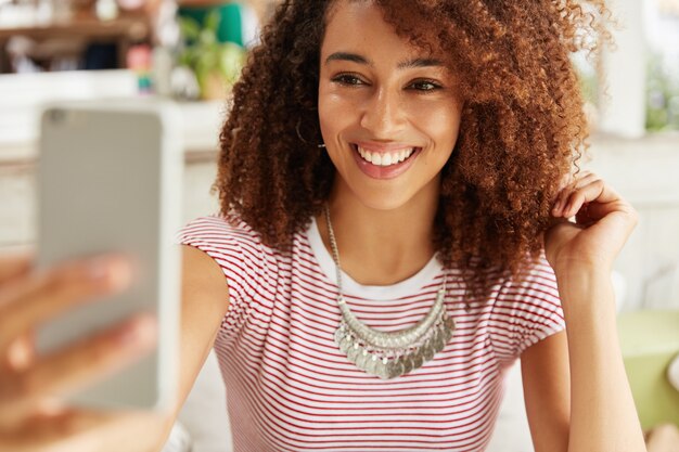 Beautiful African-American woman in cafe