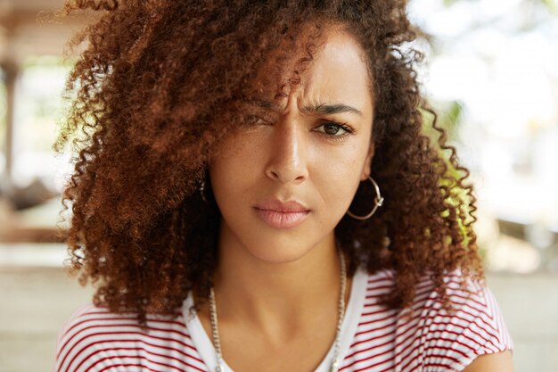 Beautiful African-American woman in cafe