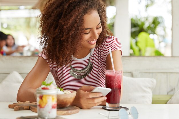 Beautiful African-American woman in cafe