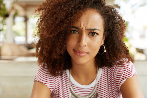 Beautiful African-American woman in cafe