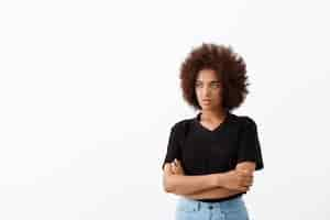 Free photo beautiful african girl thinking over light wall.