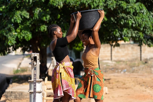 Beautiful african women fetching water