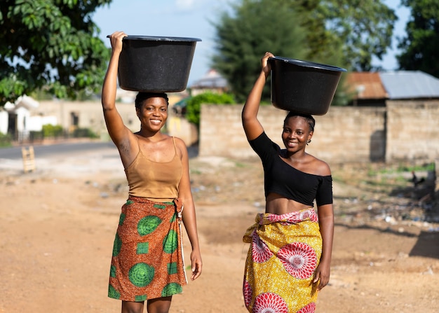 Beautiful african women fetching water