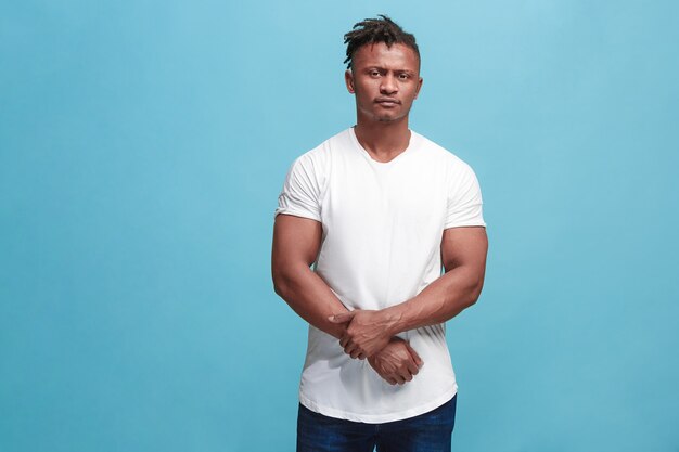 Beautiful afro-american man looking suprised and bewildered isolated on pink