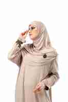 Free photo beautiful arab woman posing in stylish hijab isolated on studio. fashion concept