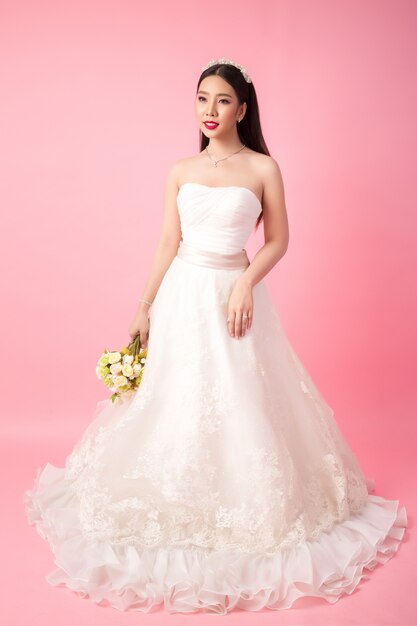 Beautiful asian bride portrait in pink studio