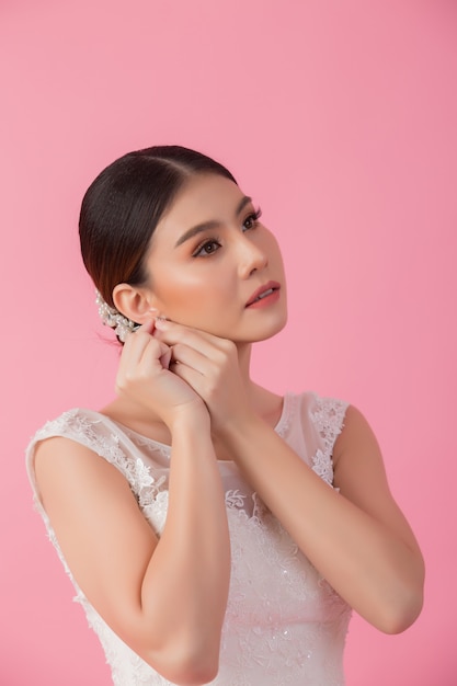 Beautiful asian bride portrait in pink 