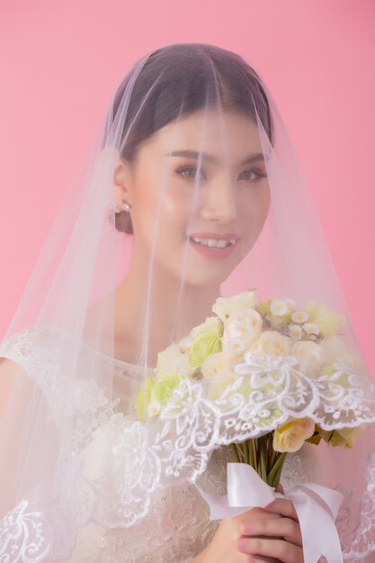 Beautiful asian bride portrait in pink 