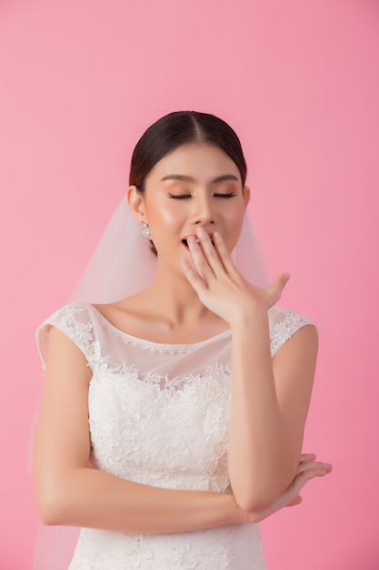 Beautiful asian bride portrait in pink 