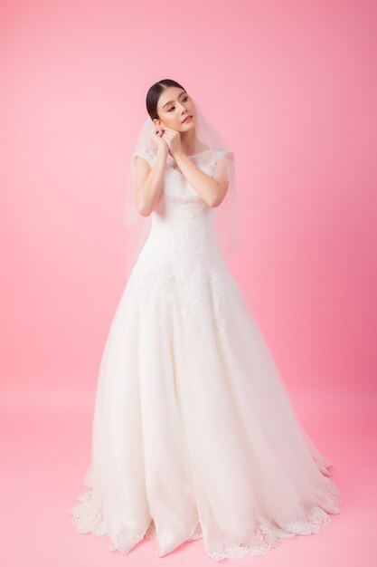 Beautiful asian bride portrait in pink 
