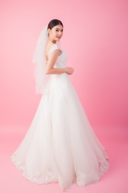 Beautiful asian bride portrait in pink