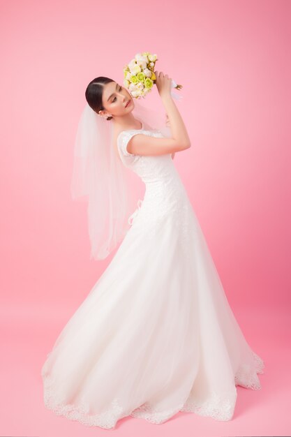 Beautiful asian bride portrait in pink 