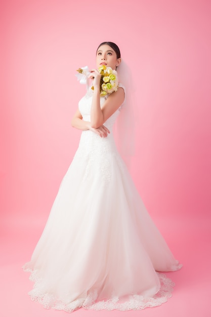 Beautiful asian bride portrait in pink 