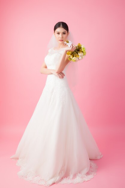 Beautiful asian bride portrait in pink