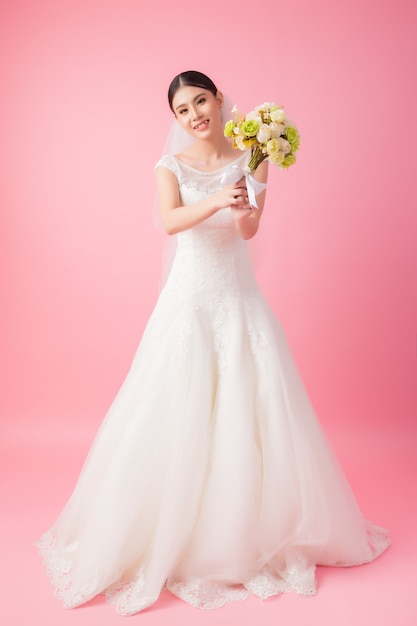 Beautiful asian bride portrait in pink