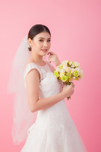 Beautiful asian bride portrait in pink