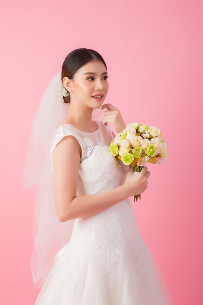 Beautiful asian bride portrait in pink 