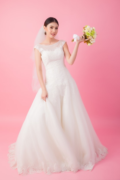 Beautiful asian bride portrait in pink 