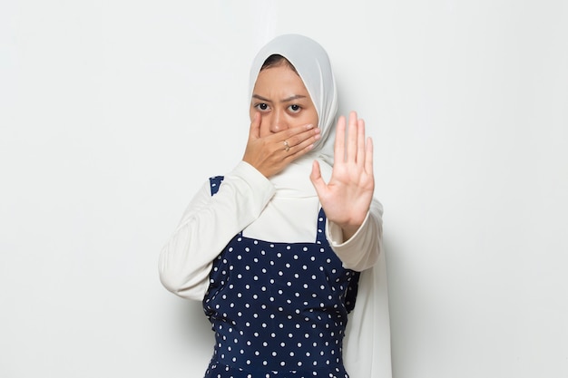 Beautiful asian muslim woman show stop hands gesture