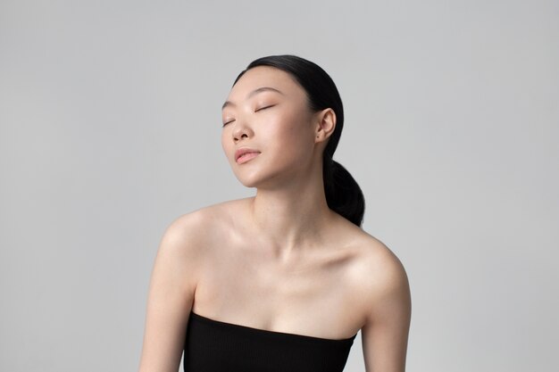 beautiful asian woman posing with perfect skin