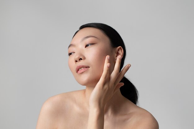 beautiful asian woman posing with perfect skin