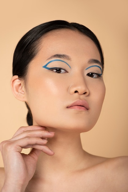 Beautiful asian woman wearing blue eyeliner