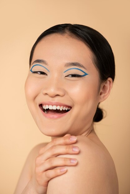 Beautiful asian woman wearing blue eyeliner