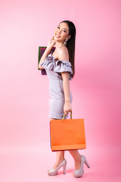 Beautiful asian woman with shopping bag