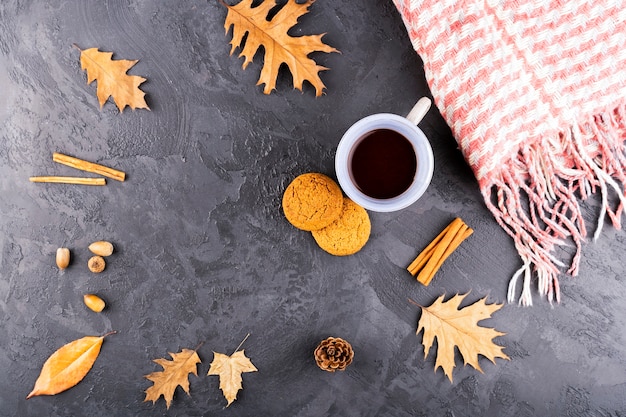 Beautiful autumn composition with coffee and scarf
