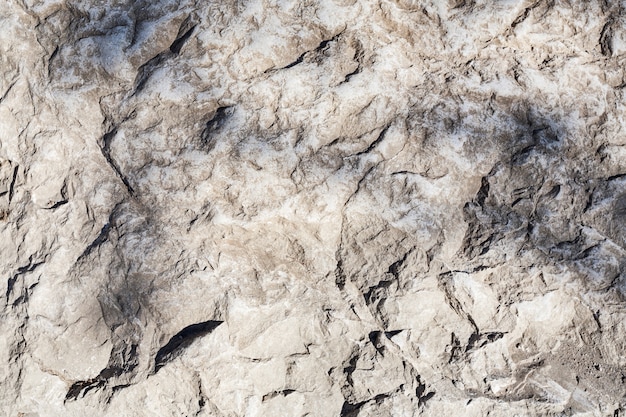 Beautiful background of a gray concrete wall with cracks