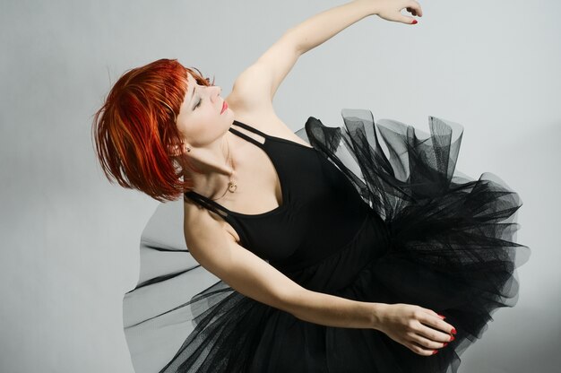 Beautiful ballerina wearing black tutu