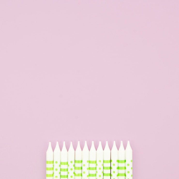 Free Photo beautiful birthday candles on pink background