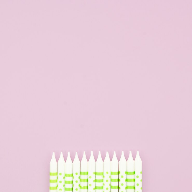 Free Photo beautiful birthday candles on pink background