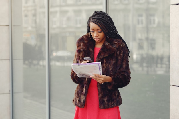 Beautiful black businesswoman in a spring city