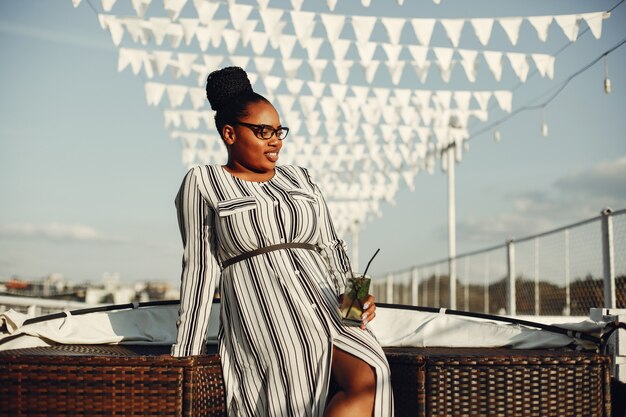 Beautiful black girl standing in a summer park