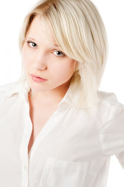 Beautiful blond teenage girl on white