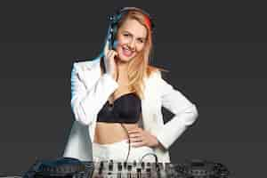 Free photo beautiful blonde dj girl on decks