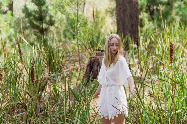 Beautiful blonde girl enjoying a day in the park