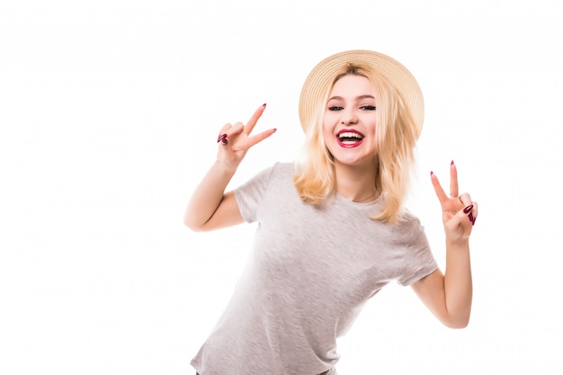 Beautiful blonde girl in hat show peace on both hands