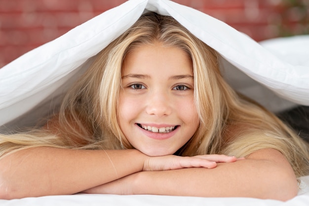 Beautiful blonde girl looking at photographer