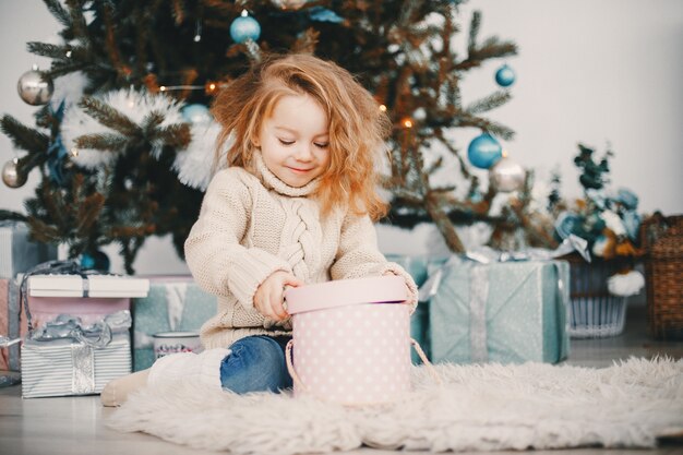 beautiful blonde girl opening gifts