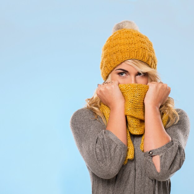 Beautiful blonde in hat and scarf