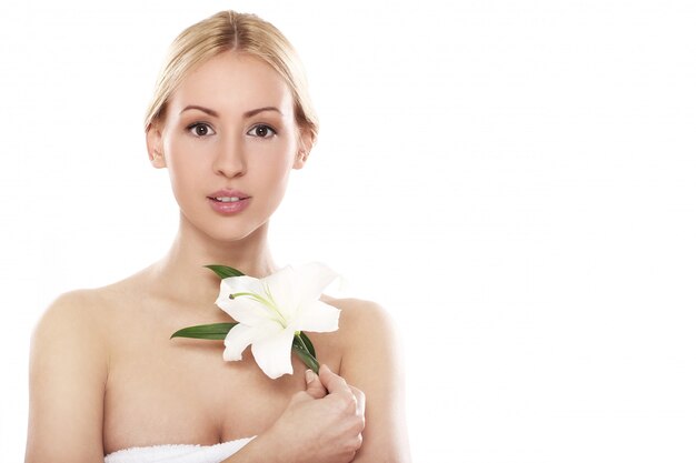 Beautiful blonde with lily flower