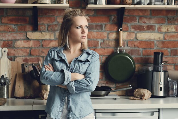 Beautiful blonde woman at home