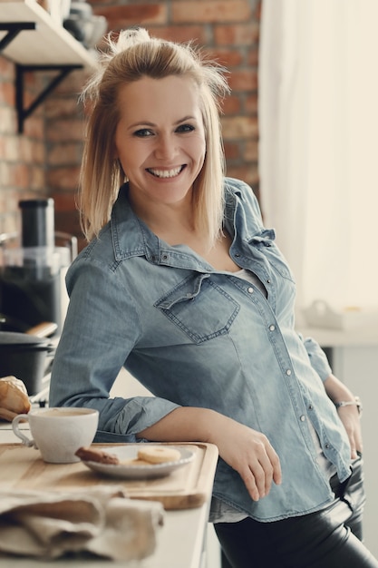 Beautiful blonde woman at home