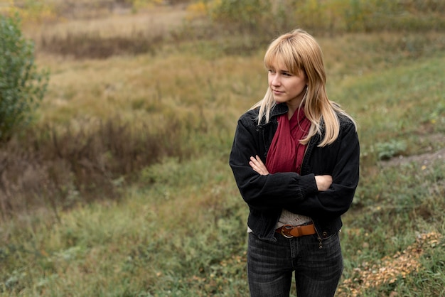 Beautiful blonde woman posing in nature