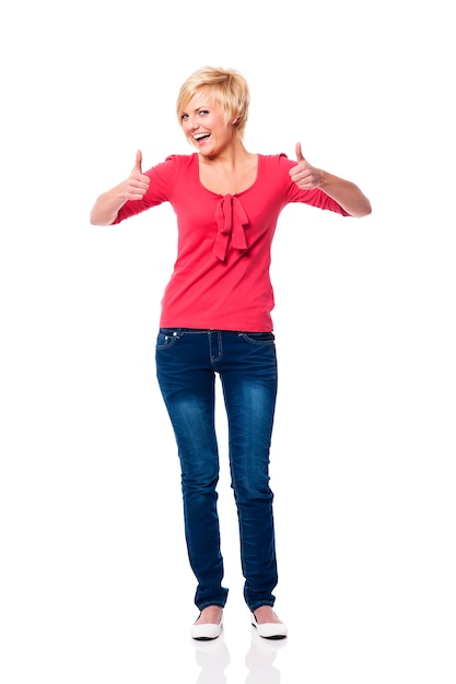 Beautiful blonde woman showing thumbs up