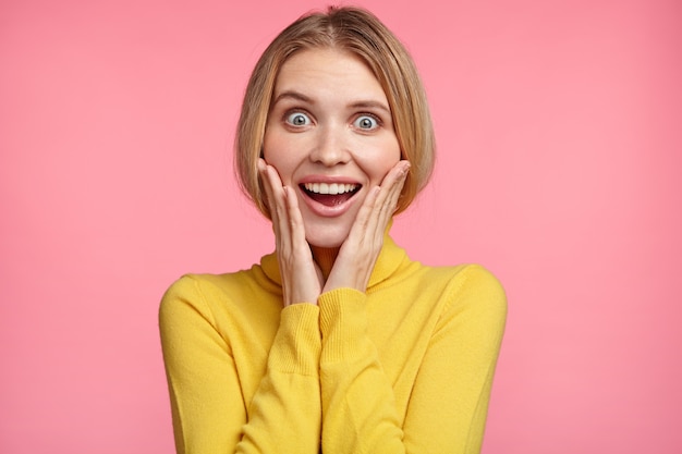 Beautiful blonde woman with yellow turtleneck